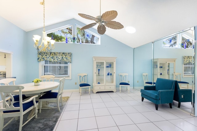 interior space with ceiling fan with notable chandelier and high vaulted ceiling