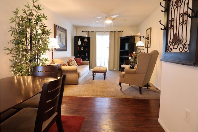 living room with ceiling fan and wood-type flooring