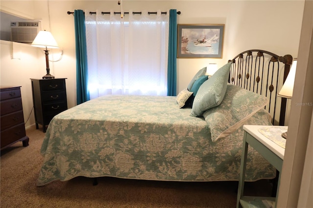 bedroom with carpet flooring and a wall mounted air conditioner