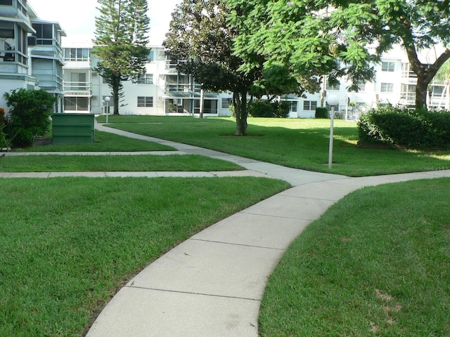 view of home's community with a lawn