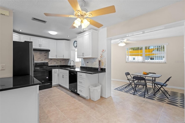 kitchen featuring white cabinetry, black appliances, light tile patterned floors, and decorative backsplash