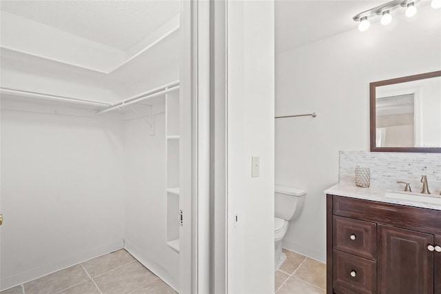 4457 Brooksdale Dr, Sarasota, FL 34232 - bathroom with tile patterned flooring, tasteful backsplash, toilet, and vanity