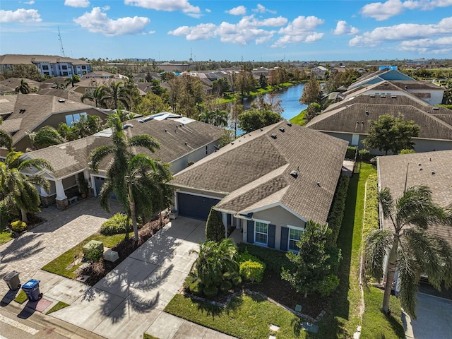 aerial view with a water view and a residential view