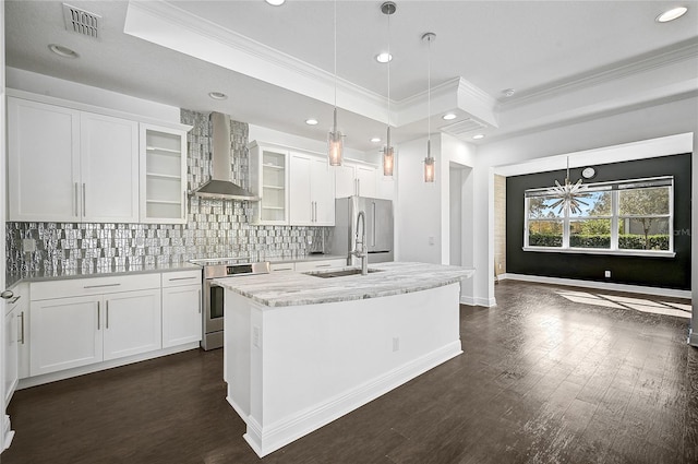 kitchen featuring light stone counters, stainless steel appliances, white cabinetry, dark hardwood / wood-style flooring, and wall chimney exhaust hood