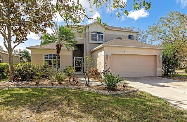 view of front of house featuring a front yard and a garage