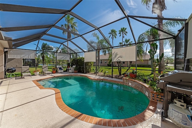 view of pool with a lanai and a patio