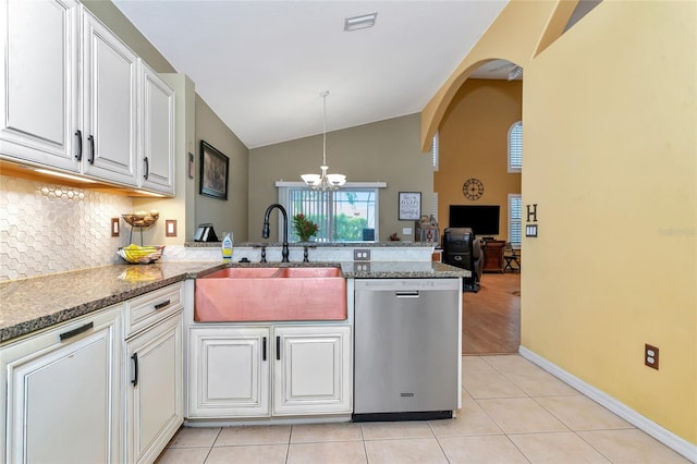 kitchen with lofted ceiling, dishwasher, kitchen peninsula, white cabinets, and sink