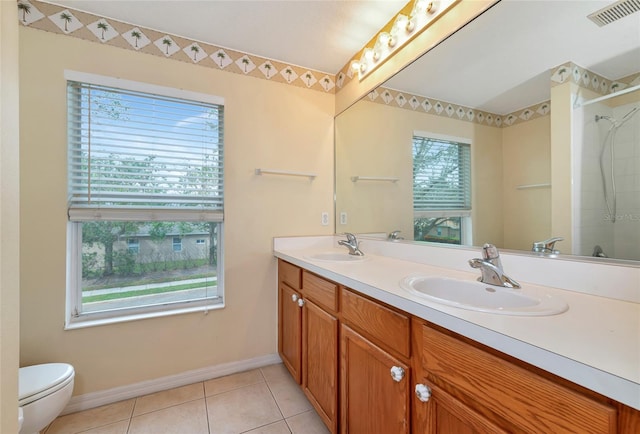 bathroom featuring walk in shower, tile patterned flooring, and a healthy amount of sunlight