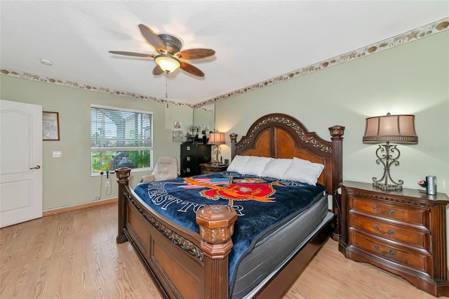 bedroom with light wood-type flooring and ceiling fan