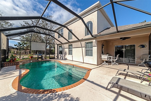 view of pool featuring a lanai, ceiling fan, and a patio area