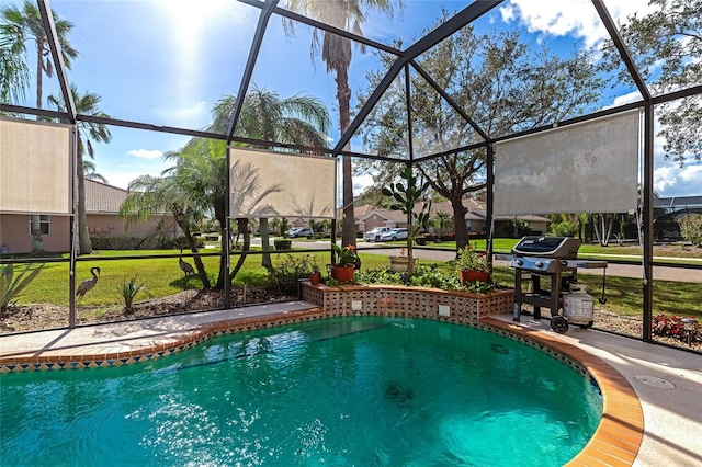 view of pool with a lanai, a grill, and a yard