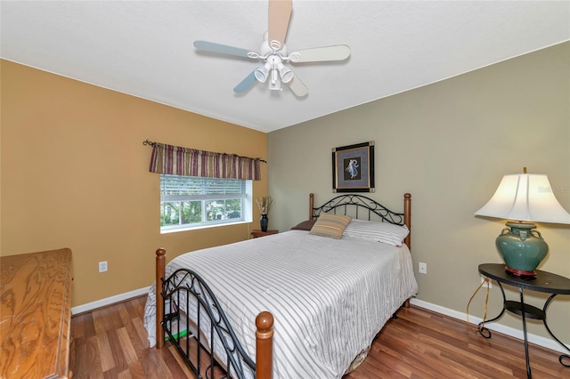 bedroom featuring hardwood / wood-style floors and ceiling fan