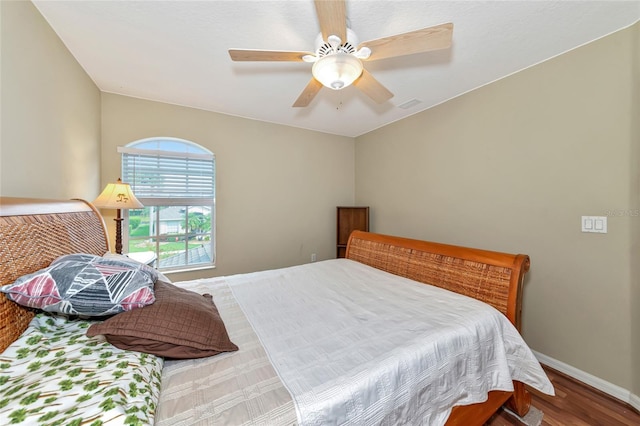 bedroom with hardwood / wood-style flooring and ceiling fan