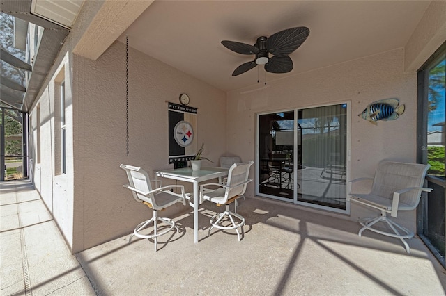 view of patio with a lanai and ceiling fan