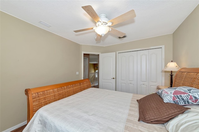 bedroom featuring ceiling fan and a closet