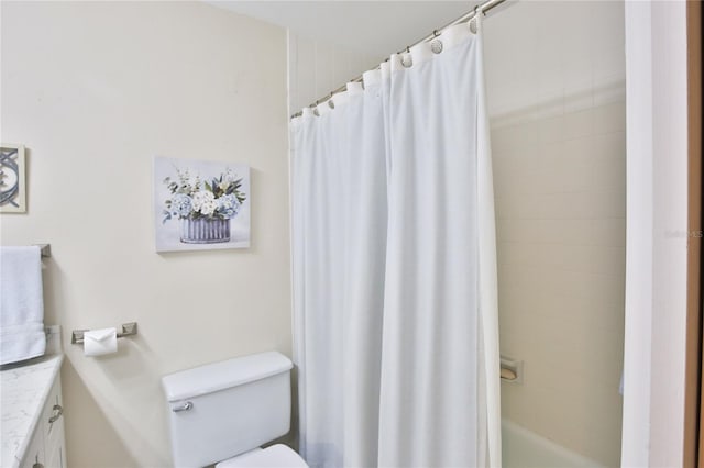 full bathroom with vanity, toilet, and shower / tub combo with curtain