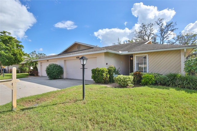 single story home with a front lawn and a garage