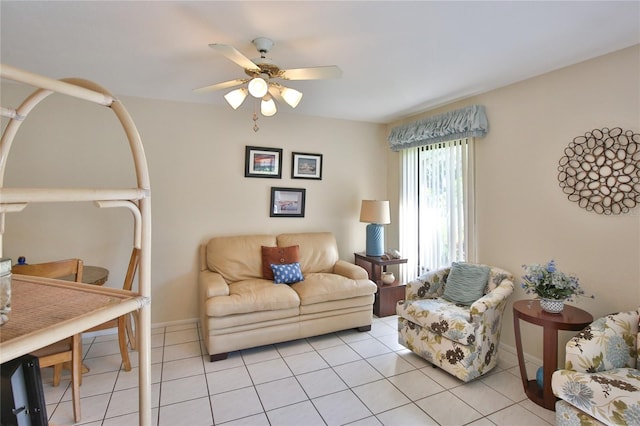 tiled living room with ceiling fan