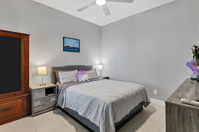 tiled bedroom with ceiling fan