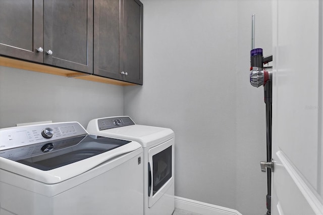 laundry area with cabinets and independent washer and dryer