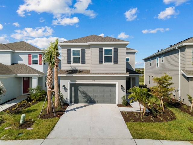 front facade featuring a garage and a front yard