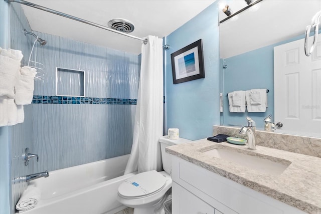 full bathroom featuring vanity, shower / bath combination with curtain, and toilet