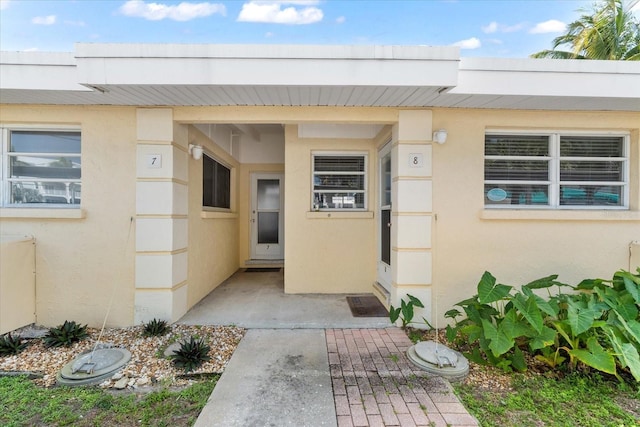 entrance to property featuring a patio