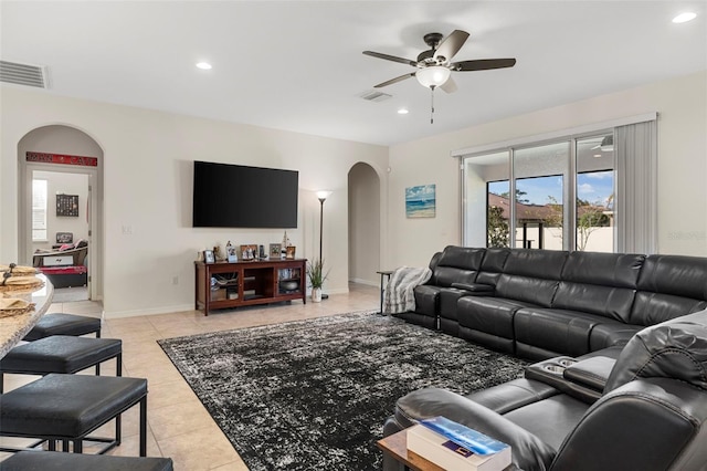 living room with ceiling fan and light tile patterned floors