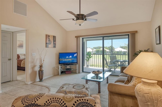 living room with ceiling fan, light colored carpet, and high vaulted ceiling