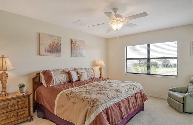 bedroom with light colored carpet and ceiling fan