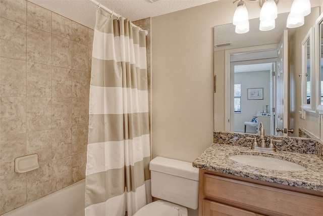 full bathroom featuring vanity, a textured ceiling, a healthy amount of sunlight, toilet, and shower / tub combo with curtain