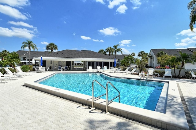 view of swimming pool featuring a patio area