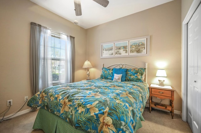 bedroom with a closet, carpet floors, and ceiling fan