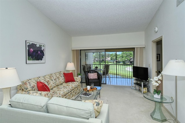 4416 Weybridge Unit 90, Sarasota, FL 34235 - living room with carpet floors, a textured ceiling, and vaulted ceiling
