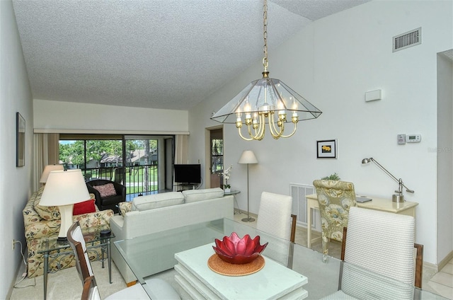 4416 Weybridge Unit 90, Sarasota, FL 34235 - dining room with a chandelier, a textured ceiling, baseboards, and lofted ceiling