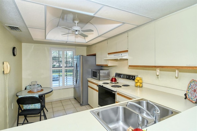 4416 Weybridge Unit 90, Sarasota, FL 34235 - kitchen featuring white electric range, under cabinet range hood, stainless steel microwave, a sink, and a ceiling fan