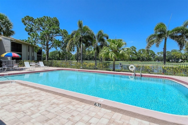 4416 Weybridge Unit 90, Sarasota, FL 34235 - community pool with fence and a patio area