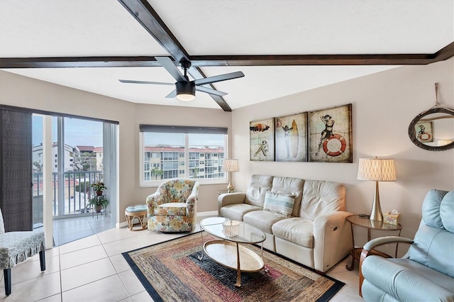 living room featuring vaulted ceiling with beams, ceiling fan, and light tile patterned floors