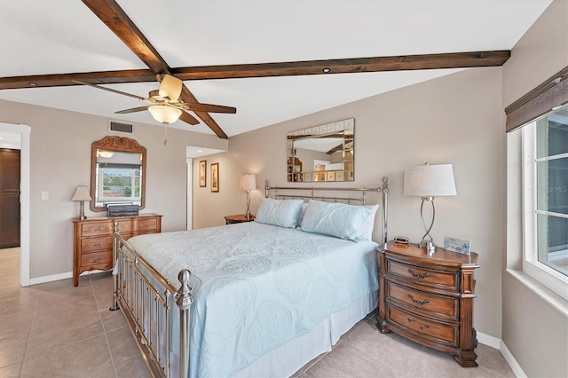 bedroom featuring beamed ceiling, ceiling fan, and light tile patterned floors