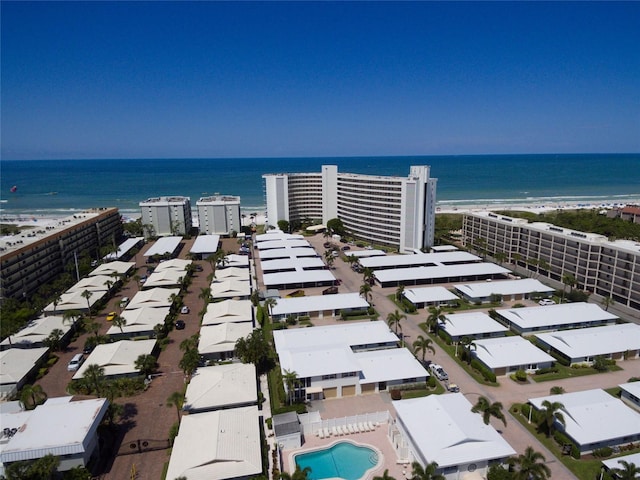 drone / aerial view with a water view and a view of the beach