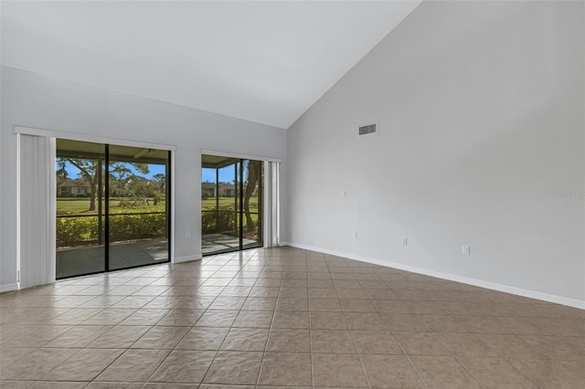 3119 Heatherwood Ln, Sarasota, FL 34235 - tiled spare room with high vaulted ceiling and baseboards