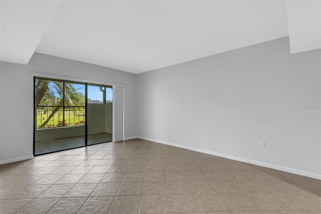 3119 Heatherwood Ln, Sarasota, FL 34235 - spare room with baseboards and light tile patterned floors
