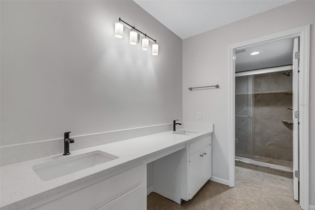 bathroom with vanity, tile patterned flooring, and an enclosed shower