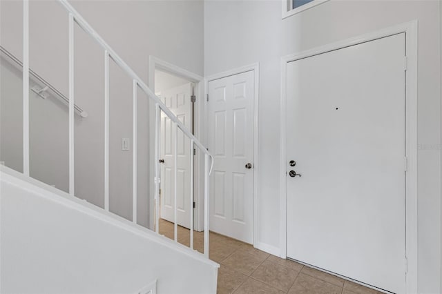 foyer entrance featuring light tile patterned floors