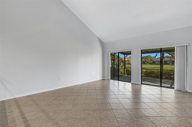 3119 Heatherwood Ln, Sarasota, FL 34235 - unfurnished room featuring high vaulted ceiling, baseboards, and light tile patterned floors