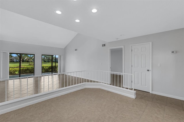 3119 Heatherwood Ln, Sarasota, FL 34235 - tiled empty room featuring lofted ceiling, recessed lighting, and baseboards