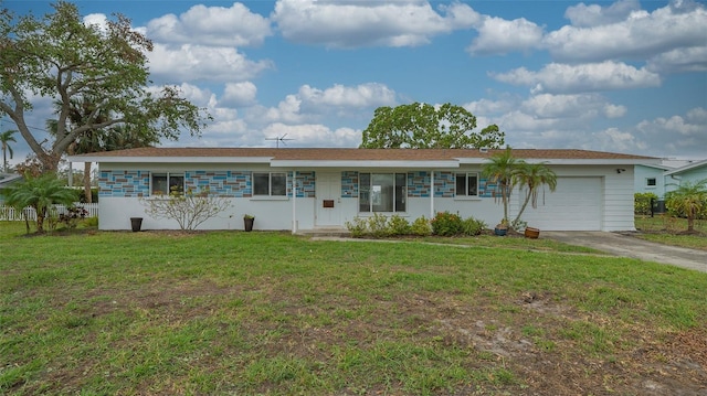 ranch-style house with a garage and a front lawn