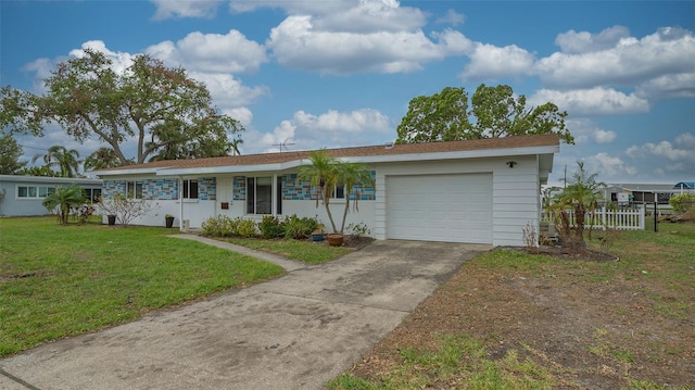 single story home with a garage and a front lawn