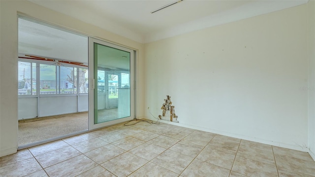 spare room with light tile patterned floors