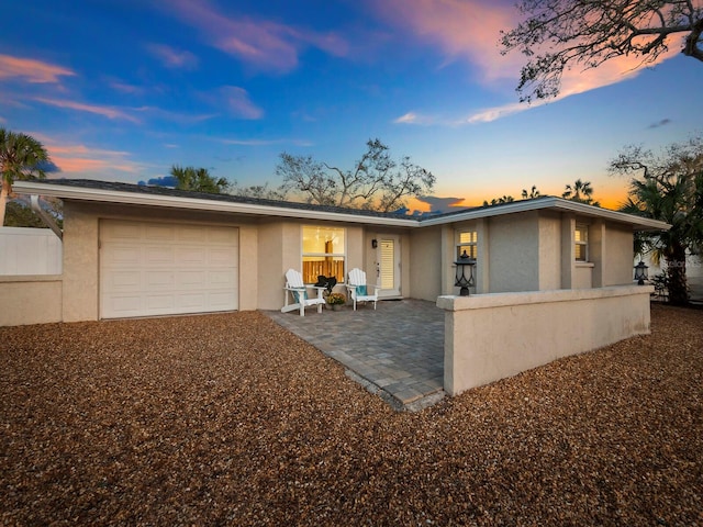 single story home featuring a garage